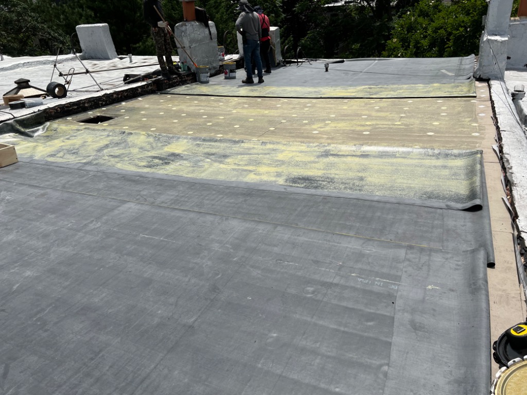 EPDM membrane installation with insulation on Brooklyn roof