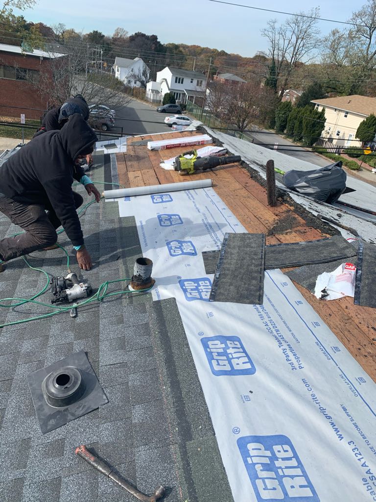 Shingle installation in progress with Grip-Rite underlayment